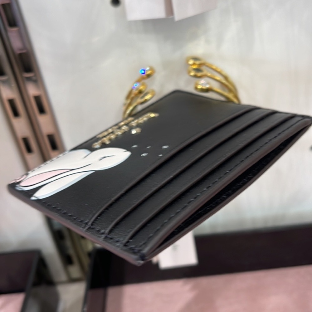 Kate Spade Bunbun Bunny Small Slim Card Holder Wallet

COLOR:
Black Multi
NWT - Picture 16 of 16